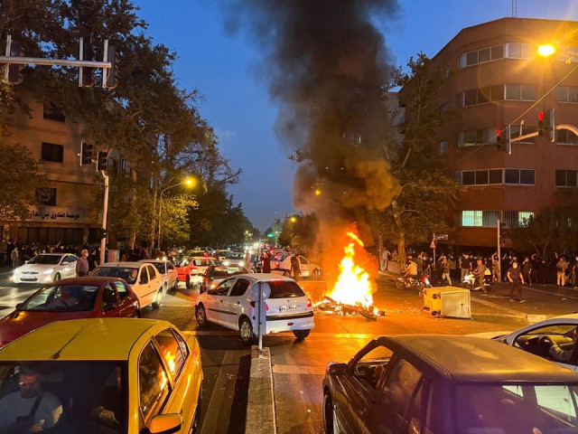 a police motorcycle burns during a protest over the death of mahsa amini a woman who died after being arrested by the islamic republic s morality police in tehran iran september 19 2022 photo reuters a police motorcycle burns during a protest over the death of mahsa amini a woman who died after being arrested by the islamic republic s morality police in tehran iran september 19 2022 photo reuters