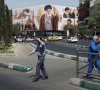 people walk past a billboard featuring images of iran s late supreme leader ayatollah ali khamenei in tehran iran july 13 2026 photo wana reuters