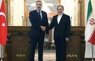 iran s foreign minister abbas araghchi r shakes hands with turkiye s foreign minister hakan fidan during press conference in tehran on november 30 2025 photo afp