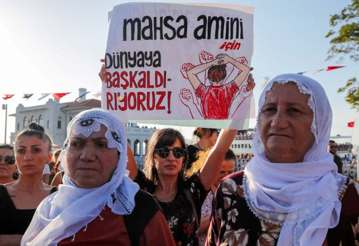 women take part in a rally on the first anniversary of the death of mahsa amini which prompted protests across the country in istanbul turkey september 16 2023 banner reads we revolt against world for mahsa amini reuters dilara senkaya file photo acquire licensing rights