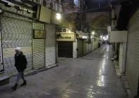 people walk past closed shops following protests over a plunge in the currency s value in the tehran grand bazaar in tehran iran january 15 2026 photo wana west asia news agency via reuters