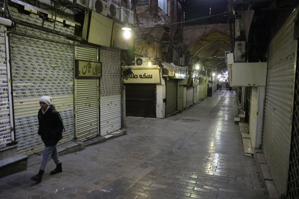 People walk past closed shops, following protests over a plunge in the currency's value, in the Tehran Grand Bazaar in Tehran, Iran, January 15, 2026. PHOTO: WANA (West Asia News Agency) via REUTERS