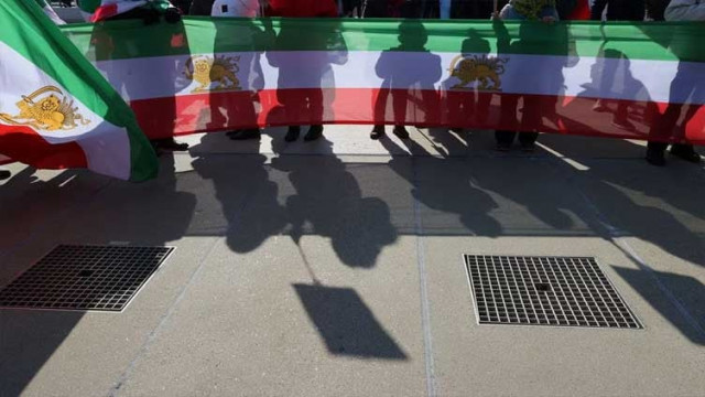 people hold flags during a demonstration against the republic of iran in the place des nations during the human rights council at the united nations in geneva switzerland february 27 2023 photo reuters people hold flags during a demonstration against the republic of iran in the place des nations during the human rights council at the united nations in geneva switzerland february 27 2023 photo reuters