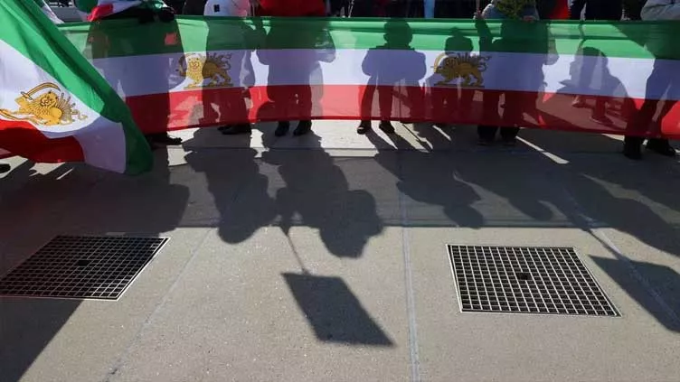 people hold flags during a demonstration against the republic of iran in the place des nations during the human rights council at the united nations in geneva switzerland february 27 2023 photo reuters people hold flags during a demonstration against the republic of iran in the place des nations during the human rights council at the united nations in geneva switzerland february 27 2023 photo reuters