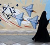 a woman walks next to an anti israeli mural on a street amid a ceasefire between u s and iran in tehran iran april 20 2026 reuters
