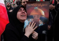 a woman reacts as people gather at the enghelab square after iran s supreme leader ayatollah ali khamenei was killed in israeli and u s strikes on saturday in tehran iran march 1 2026 photo reuters