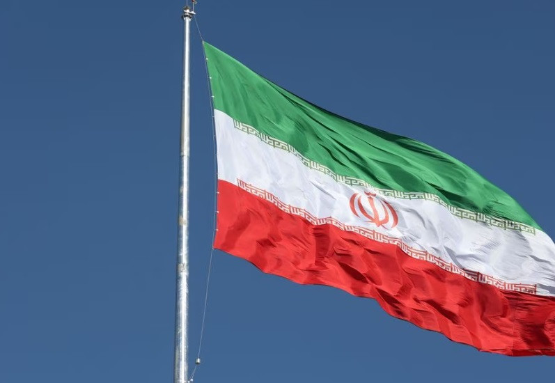 the iranian flag is seen flying over a street in tehran iran february 3 2023 photo reuters