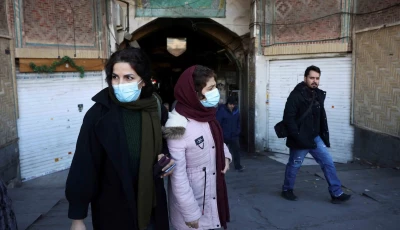 people walk past closed shops following protests over a plunge in the currency s value in the tehran grand bazaar in tehran iran december 30 2025 reuters