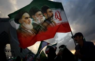 a man holds a flag with a picture of late leader of the islamic revolution ayatollah ruhollah khomeini late supreme leader of iran ayatollah ali khamenei and iran s new supreme leader mojtaba khamenei during a rally in tehran on april 29 2026 photo reuters