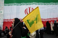 a woman holds a hezbollah flag during a rally in support of iran s supreme leader mojtaba khamenei in tehran iran on june 4 2026 west asia news agency via reuters