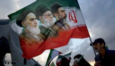 political expression a man holds a flag with a picture of late leader of the islamic revolution ayatollah ruhollah khomeini during a rally in tehran on april 29 2026 photo reuters file