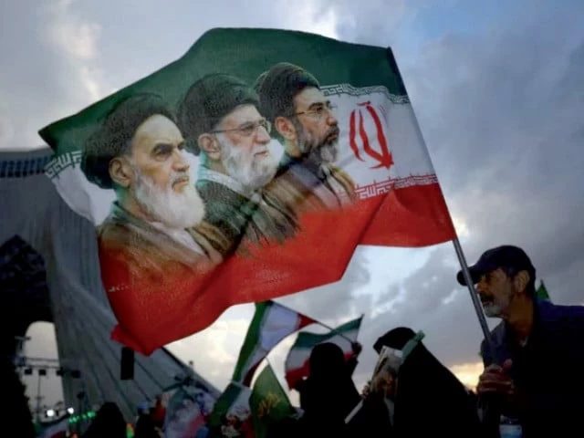 political expression a man holds a flag with a picture of late leader of the islamic revolution ayatollah ruhollah khomeini during a rally in tehran on april 29 2026 photo reuters file political expression a man holds a flag with a picture of late leader of the islamic revolution ayatollah ruhollah khomeini during a rally in tehran on april 29 2026 photo reuters file