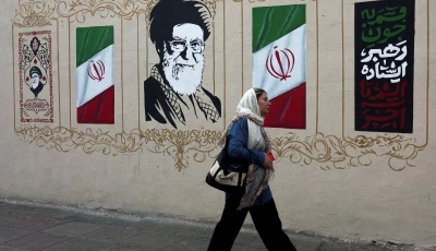 a woman walks by a mural depicting iran s late supreme leader ayatollah ali khamenei on a street in tehran iran august 13 2026 photo reuters a woman walks by a mural depicting iran s late supreme leader ayatollah ali khamenei on a street in tehran iran august 13 2026 photo reuters