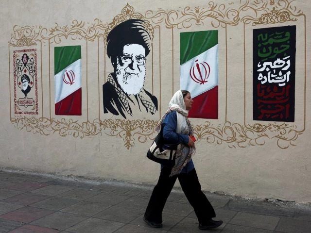a woman walks by a mural depicting iran s late supreme leader ayatollah ali khamenei on a street in tehran iran august 13 2026 photo reuters a woman walks by a mural depicting iran s late supreme leader ayatollah ali khamenei on a street in tehran iran august 13 2026 photo reuters