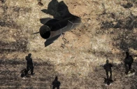 a drone view shows members of military engineering teams working at the site where according to local authorities an iranian missile fell in the countryside near damascus syria june 9 2026 photo reuters