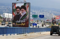 cars and motorbikes drive past billboards showing iran s new supreme leader ayatollah mojtaba khamenei and his late father ali khamenei with the slogan thank you to loyal iran erected along the highway leading to rafic hariri international airport in beirut lebanon june 22 2026 photo reuters