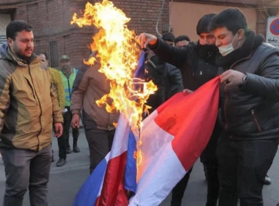 iran france tensions escalate over charlie hebdo cartoons row