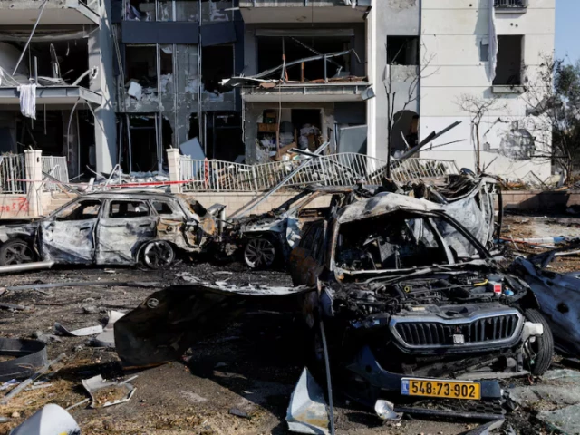 a view of burnt cars and a damaged residential building at an impact site following iran s missile strike on israel in be er sheva israel june 20 photo reuters a view of burnt cars and a damaged residential building at an impact site following iran s missile strike on israel in be er sheva israel june 20 photo reuters