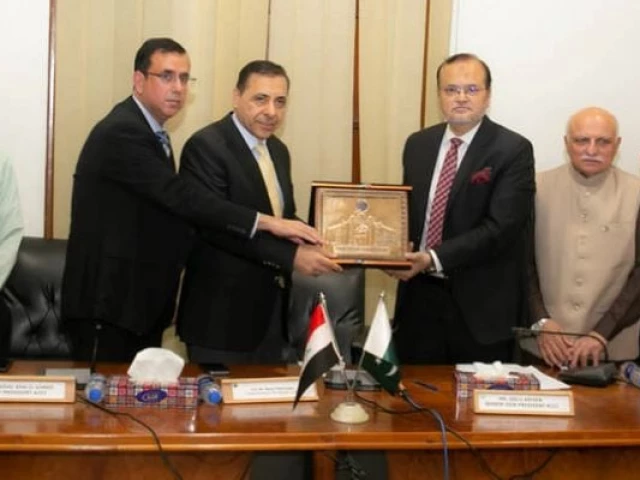 in this handout photo taken and released by the karachi chamber of commerce industry on april 16 2025 iraq s consul general maher mjhid jejan 4l receives a souvenir from officials during his visit to the kcci office in karachi photo handout kcci in this handout photo taken and released by the karachi chamber of commerce industry on april 16 2025 iraq s consul general maher mjhid jejan 4l receives a souvenir from officials during his visit to the kcci office in karachi photo handout kcci