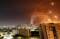 streaks of light are seen as israel s iron dome anti missile system intercepts rockets launched from the gaza strip towards israel as seen from ashkelon israel may 12 reuters