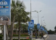 hoardings displaying flags of the us pakistan and iran as pakistan prepares to host the us and iran for the second phase of peace talks in islamabad on april 18 2026 photo reuters
