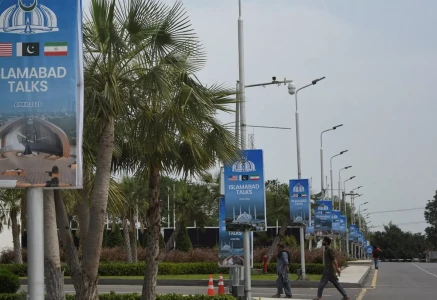 hoardings displaying flags of the us pakistan and iran as pakistan prepares to host the us and iran for the second phase of peace talks in islamabad on april 18 2026 photo reuters