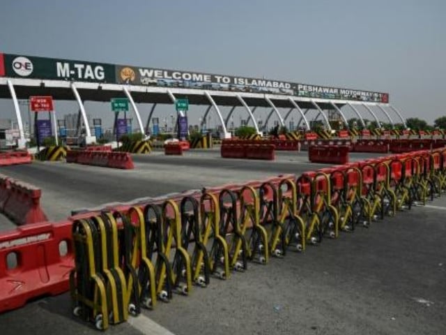 A general view shows the Islamabad–Peshawar Motorway blocked with trucks placed by authorities in Islamabad on September 24, 2026, ahead of opposition party Pakistan Tehreek-e-Insaf (PTI) protest demanding the release of former Prime Minister Imran Khan. Photo: AFP