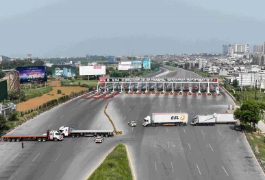 an aerial view shows the islamabad peshawar motorway blocked with trucks placed by authorities in islamabad on september 24 2026 ahead of opposition party pakistan tehreek e insaf pti protest demanding the release of former prime minister imran khan photo afp