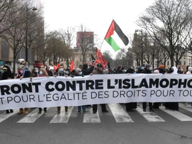 protesters hold a banner at a demonstration against a bill dubbed as anti separatism and islamophobic in paris france on march 21 2021 photo reuters
