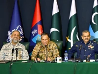 rear admiral shifaat ali khan l dg ispr lieutenant general ahmed sharif chaudhry c and air vice marshal tariq ghazi during a press conference on may 7 2026 screengrab