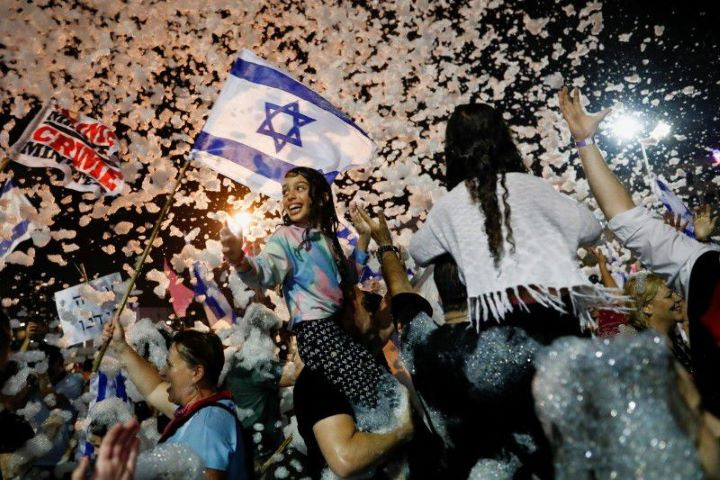 people celebrate after israel s parliament voted in a new coalition government ending benjamin netanyahu s 12 year hold on power at rabin square in tel aviv israel june 13 2021 reuters corinna kern