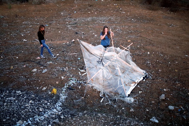 Israeli teens, Meshy Elmkies (R), 16, and Lee Cohen, 17, co-managers of Instagram account, Otef.Gaza, show Reuters journalists an incendiary kite launched from the Gaza Strip, during an interview in Kibbutz Kerem Shalom which borders the Gaza Strip, in southern Israel. PHOTO: REUTERS