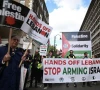 pro palestinian supporters wave flags and hold placards as they pass through central london uk photo afp