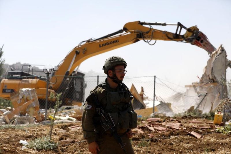 an israeli soldier with bulldozer in the occupied gaza photo qatar tribune