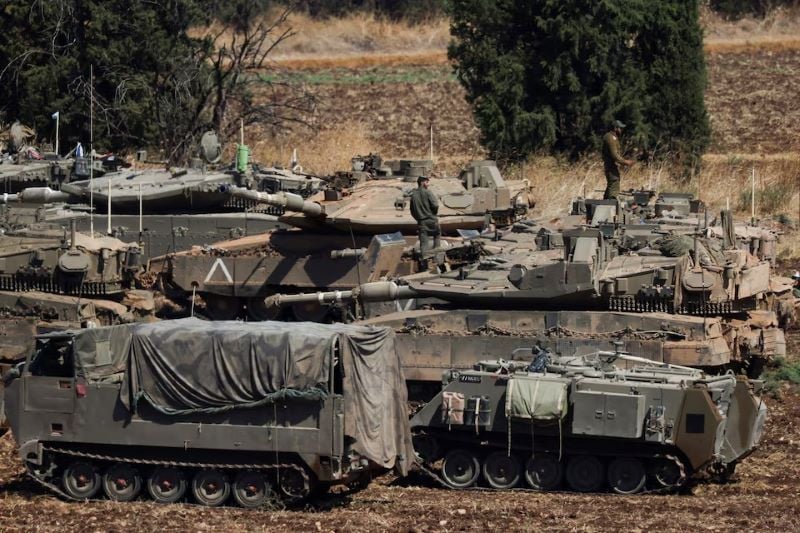 people work on israeli army tanks amid cross border hostilities between hezbollah and israel in northern israel on september 27 2024 photo reuters