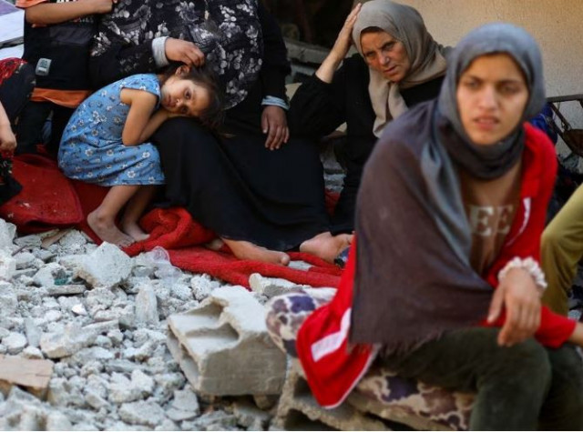 najah nabhan the mother of five disabled palestinian siblings who were ordered by the israeli army to leave their apartment before the residential building they live in was bombed by israel in recent israel gaza fighting sits amid the rubble of the building in the northern gaza strip may 15 2023 photo reuters najah nabhan the mother of five disabled palestinian siblings who were ordered by the israeli army to leave their apartment before the residential building they live in was bombed by israel in recent israel gaza fighting sits amid the rubble of the building in the northern gaza strip may 15 2023 photo reuters