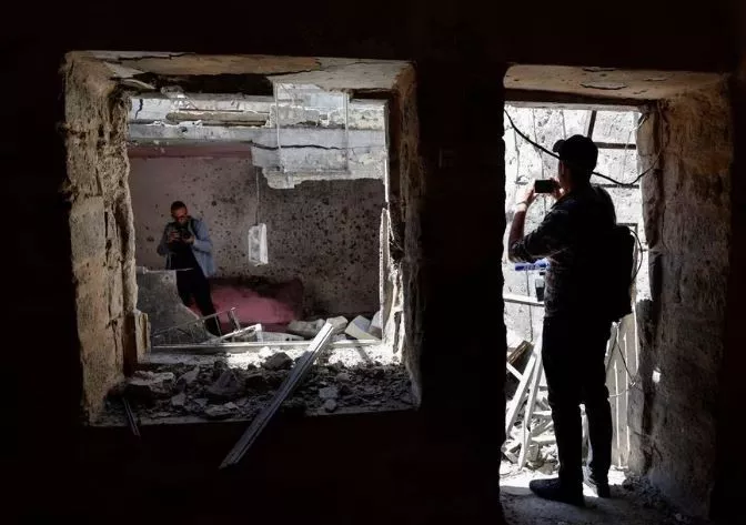 people take pictures at the site where israeli forces killed palestinian gunmen in a raid according to the israeli military in nablus in the israeli occupied west bank may 4 2023 photo reuters people take pictures at the site where israeli forces killed palestinian gunmen in a raid according to the israeli military in nablus in the israeli occupied west bank may 4 2023 photo reuters