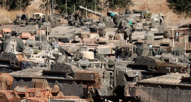 israeli army tanks and armoured vehicles are deployed in the upper galilee region of northern israel near the border with lebanon on sept 29 2024 photo afp