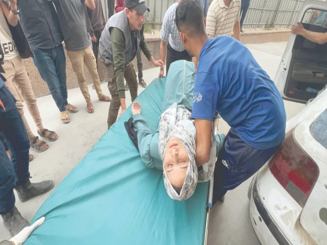 a wounded palestinian woman is placed on a stretcher after the european hospital was partially damaged following israeli airstrikes in gaza photo reuters a wounded palestinian woman is placed on a stretcher after the european hospital was partially damaged following israeli airstrikes in gaza photo reuters