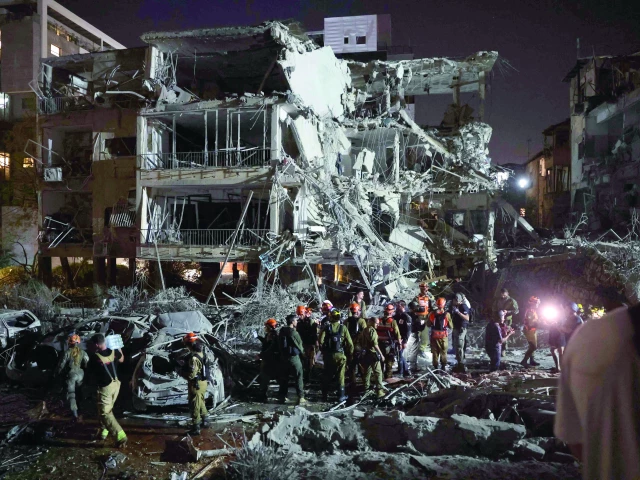 israeli troops and first responders gather in an area hit by a missile fired from iran in ramat gan near tel aviv photo afp israeli troops and first responders gather in an area hit by a missile fired from iran in ramat gan near tel aviv photo afp