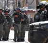 members of israeli security forces patrol along a street during a military raid in the neighbourhood of kafr aqab near ramallah in the israeli occupied west bank on january 26 2026 photo afp