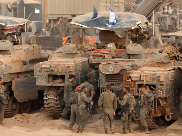 israeli army soldiers gather near infantry fighting vehicles ifvs at a position along the israel gaza border fence on october 10 2025 gaza s civil defence agency said october 10 that israeli forces have begun pulling back from parts of the territory particularly in gaza city and khan yunis photo afp israeli army soldiers gather near infantry fighting vehicles ifvs at a position along the israel gaza border fence on october 10 2025 gaza s civil defence agency said october 10 that israeli forces have begun pulling back from parts of the territory particularly in gaza city and khan yunis photo afp