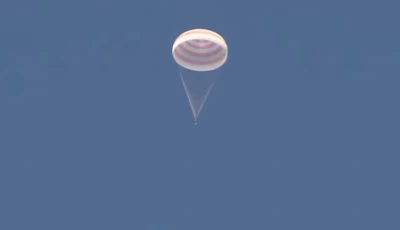 the soyuz ms 28 capsule carrying the international space station iss crew of nasa astronaut christopher williams roscosmos cosmonauts sergey kud sverchkov and sergei mikaev descends by parachute before landing in a remote area near zhezkazgan kazakhstan july 26 2026 in this still image taken from live broadcast video photo roscosmos via reuters the soyuz ms 28 capsule carrying the international space station iss crew of nasa astronaut christopher williams roscosmos cosmonauts sergey kud sverchkov and sergei mikaev descends by parachute before landing in a remote area near zhezkazgan kazakhstan july 26 2026 in this still image taken from live broadcast video photo roscosmos via reuters