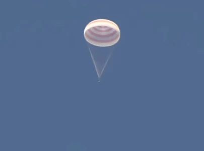 spacecraft brings russians american back to earth russia s space agency says spacecraft brings russians american back to earth russia s space agency says