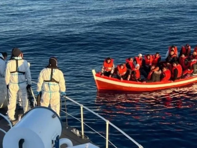 italian coast guards near an immigrant boat photo bbc italian coastal guard italian coast guards near an immigrant boat photo bbc italian coastal guard