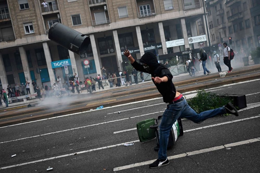 Protesters clashed with riot police at Milan’s Centrale station during a USB-led national strike urging Italy to cut ties with Israel. AFP