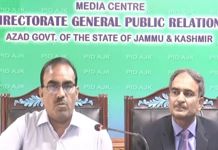 ajk home secretary chaudhry guftar hussain addresses a press conference alongside elementary and secondary education secretary qazi inayat in mirpur on tuesday screengrab