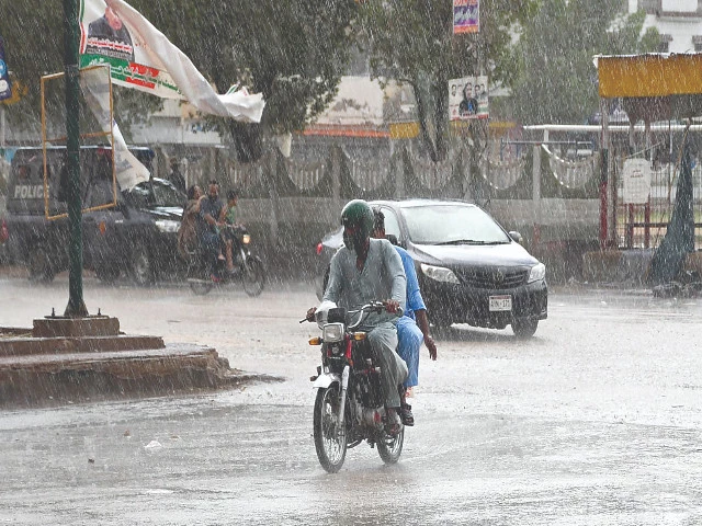 commuters navigate through hyderabad s streets as a summer downpour brings relief from the heat on wednesday photo inp commuters navigate through hyderabad s streets as a summer downpour brings relief from the heat on wednesday photo inp