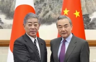 japan s foreign minister takeshi iwaya and chinese foreign minister wang yi shake hands in beijing s diaoyutai state guesthouse dec 25 2024 photo kyodo news