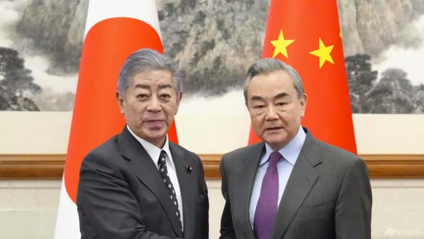 japan s foreign minister takeshi iwaya and chinese foreign minister wang yi shake hands in beijing s diaoyutai state guesthouse dec 25 2024 photo kyodo news